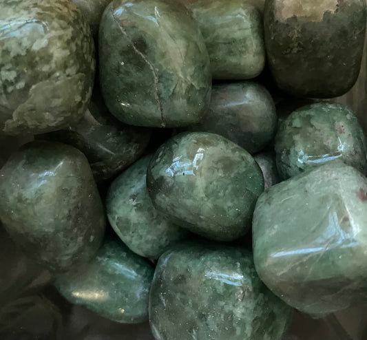 Grossularite (green garnet) tumbled stone